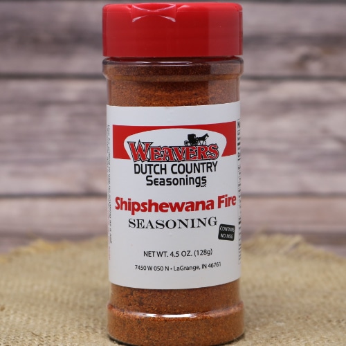 Close-up of Weaver's Dutch Country Seasonings Shipshewana Fire Seasoning bottle, emphasizing the bright red cap and spicy contents.