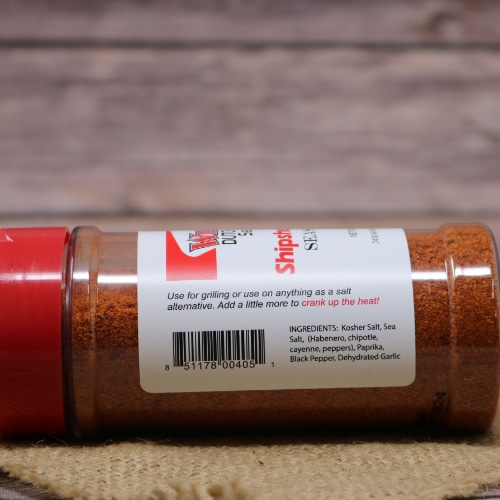 Label on Weaver's Shipshewana Fire Seasoning with usage tips and ingredients list, including kosher salt and various peppers, angled against a burlap backdrop