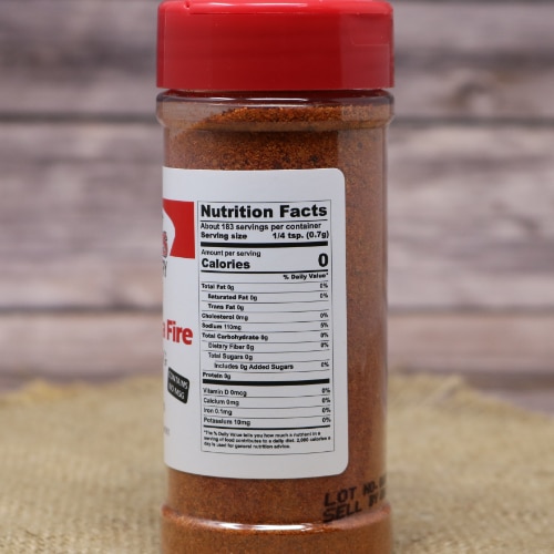 Nutritional facts label on the side of Weaver's Shipshewana Fire Seasoning bottle, detailing servings and ingredients against a burlap background.