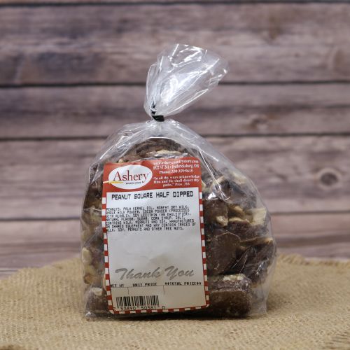 Clear plastic Ashery bag with red and white sticker label filled with chocolate coverd peanut candies, sitting on a burlap material with wood background