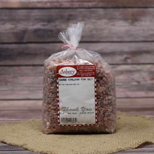 Bag of pink Himalayan salt with a red and white lable
