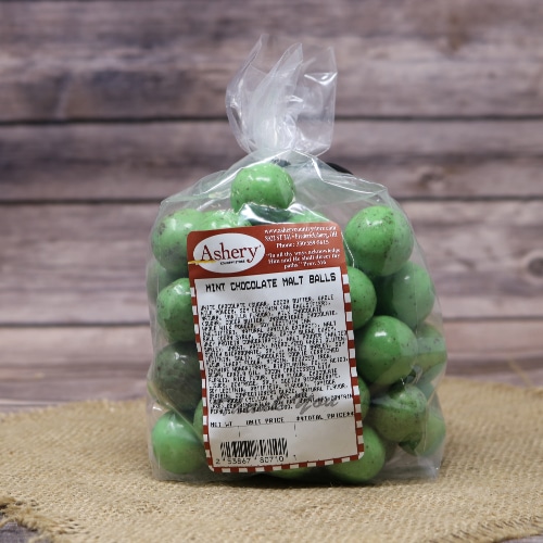 plastic bag with red and white label, filled with green colored candies