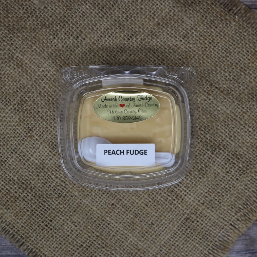 Container of Amish Country Peach Fudge on a burlap mat.