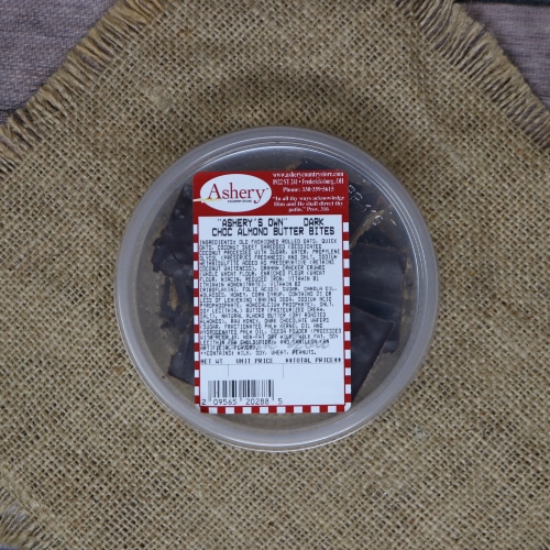 Container of Ashery's Own Dark Chocolate Almond Butter Bites on a burlap mat.