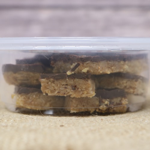 Side view of a container of Ashery's Own Dark Chocolate Peanut Butter Bites.