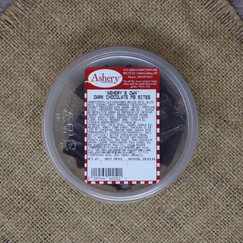 Container of Ashery's Own Dark Chocolate Peanut Butter Bites on a burlap mat.