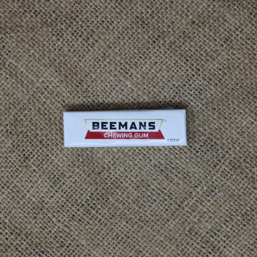 Pack of Beemans Chewing Gum on a burlap mat.