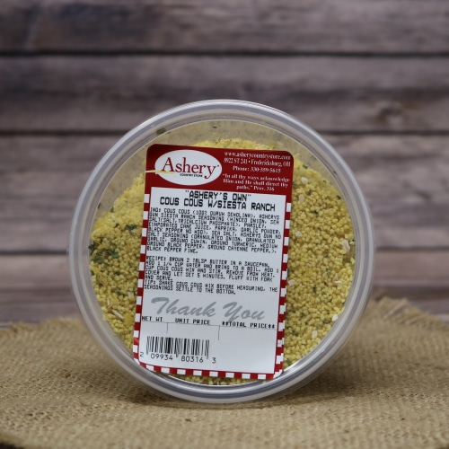 Container of Ashery's Own Cous Cous with Siesta Ranch on a burlap mat with a rustic wooden background.
