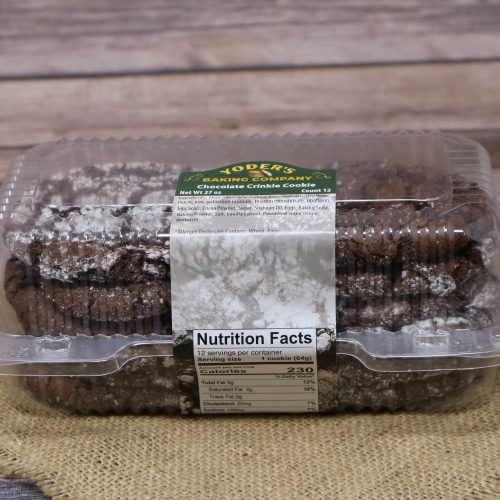 Container of Yoder's Chocolate Crinkle Cookies on a burlap mat with a rustic wooden background.